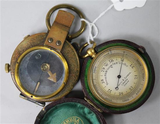 A WWI cased compass and a Negretti & Zambra pocket barometer